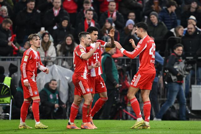 29 November 2025, Bavaria, Munich: Bayern Munich's Raphael Guerreiro (2nd L) celebrates scoring his side's first goal with teammates Luis Diaz (2nd R), Lennart Karl (L) and Aleksandar Pavlovic during the German Bundesliga soccer match between Bayern Munich and FC St. Pauli at Allianz Arena. Photo: Sven Hoppe/dpa - IMPORTANT NOTICE: DFL and DFB regulations prohibit any use of photographs as image sequences and/or quasi-video.
