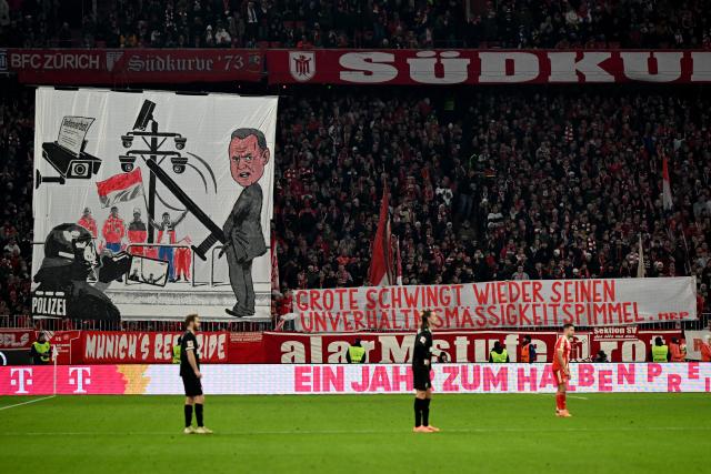 29 November 2025, Bavaria, Munich: Munich fans hold up banners and protest against the planned political measures on security issues during the German Bundesliga soccer match between Bayern Munich and FC St. Pauli at Allianz Arena. Photo: Sven Hoppe/dpa - IMPORTANT NOTICE: DFL and DFB regulations prohibit any use of photographs as image sequences and/or quasi-video.