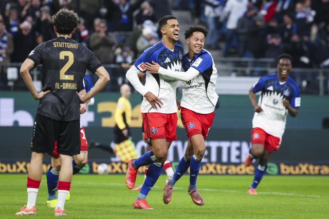 30 November 2025, Hamburg: Hamburger's Robert Glatzel (L) celebrates scoring his side's first goal with teammate Alexander Rossing-Lelesiit during the German Bundesliga soccer match between Hamburger SV and VfB Stuttgart at the Volksparkstadion. Photo: Christian Charisius/dpa - IMPORTANT NOTICE: DFL and DFB regulations prohibit any use of photographs as image sequences and/or quasi-video.