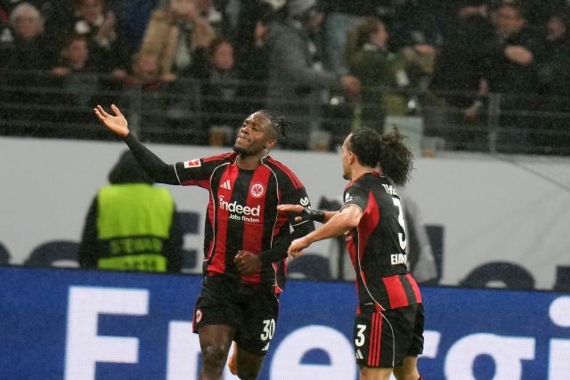 30 November 2025, Hesse, Frankfurt/M.: Eintracht Frankfurt's Michy Batshuayi (L) celebrates scoring his side's first goal with teammate Arthur Theate during the German Bundesliga soccer match between Eintracht Frankfurt and VfL Wolfsburg at the Deutsche Bank Park. Photo: Thomas Frey/dpa - IMPORTANT NOTICE: DFL and DFB regulations prohibit any use of photographs as image sequences and/or quasi-video.