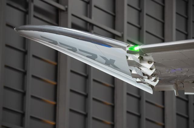 FILED - 19 November 2021, Hesse, Frankfurt/Main: The wing tip of the Boeing 777 is folded up during the presentation of the new aircraft type in a Lufthansa hangar at the airport. US-Irish aviation leasing company AerCap Holdings announced on Monday that it has made its first delivery to a Hong Kong-based aviation leasing firm. Photo: Boris Roessler/dpa