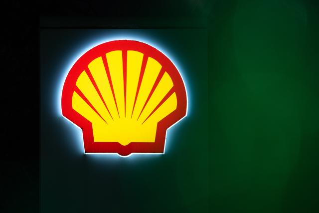 FILED - 11 November 2024, Berlin: A Shell logo glows in the dark at a gas station in Berlin. Photo: Hannes P Albert/dpa