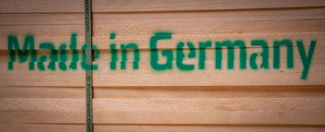 FILED - 13 August 2025, Mecklenburg-Vorpommern, Malchow: The spray-painted lettering "Made in Germany" can be seen on pre-packed raw wood planks in a sawmill. German exporters should expect further losses in their most important market, the United States, in the coming year, due to the Trump administration's tariff policy. Photo: Jens Büttner/dpa