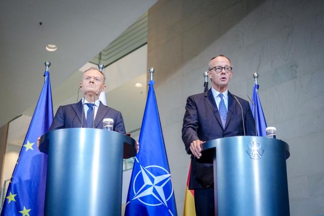01 December 2025, Berlin: German Chancellor Friedrich Merz and Polish Prime Minister Donald Tusk (L), hold a joint press conference on the occasion of the German-Polish government consultations at the Federal Chancellery in Berlin. Photo: Kay Nietfeld/dpa