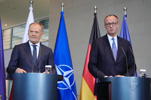01 December 2025, Berlin: German Chancellor Friedrich Merz and Polish Prime Minister Donald Tusk (L), hold a joint press conference on the occasion of the German-Polish government consultations at the Federal Chancellery in Berlin. Photo: Kay Nietfeld/dpa