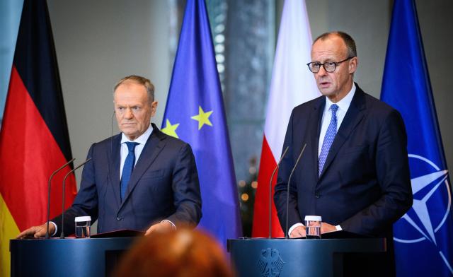 01 December 2025, Berlin: German Chancellor Friedrich Merz (R) and Polish Prime Minister Donald Tusk, hold a joint press conference on the occasion of the German-Polish government consultations at the Federal Chancellery in Berlin. Photo: Bernd von Jutrczenka/dpa