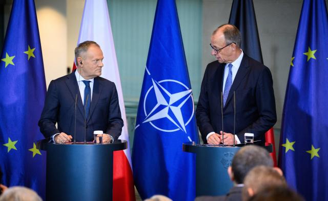 01 December 2025, Berlin: German Chancellor Friedrich Merz (R) and Polish Prime Minister Donald Tusk, hold a joint press conference on the occasion of the German-Polish government consultations at the Federal Chancellery in Berlin. Photo: Bernd von Jutrczenka/dpa