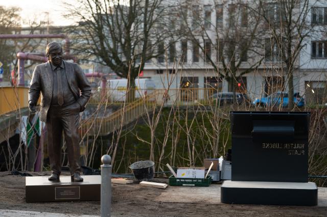 02 December 2025, Berlin: Activists erect a statue of Walter Luebcke in front of the Konrad Adenauer House. Photo: Markus Lenhardt/dpa