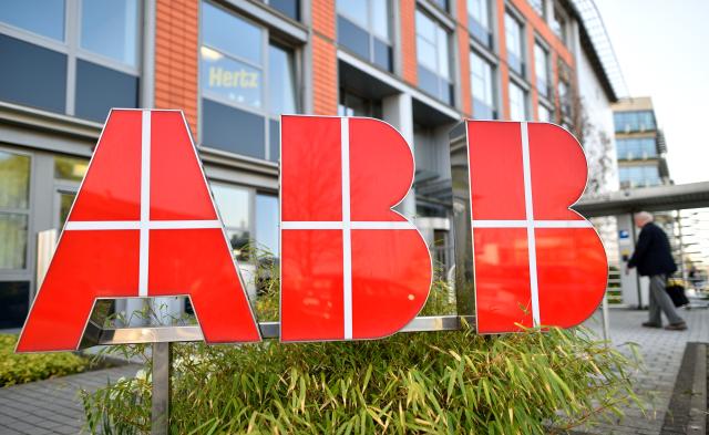 FILED - 26 March 2014, Baden-Wuerttemberg, Mannheim: The logo of the Swiss company ABB can be seen at the entrance of the group's headquarters in Germany. Photo: Uwe Anspach/dpa