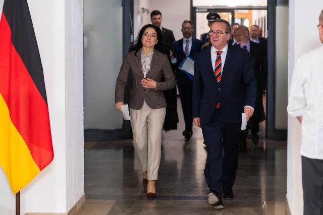 02 December 2025, Berlin: Katherina Reiche, Germany's Minister for Economic Affairs and Energy, and Boris Pistorius, Germany's Defence Minister, attend a press conference during a meeting between representatives of the security and defence industry, the automotive and supplier industry, and the federal government. Photo: Christophe Gateau/dpa