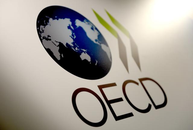 FILED - 27 May 2015, Berlin: The logo of the Organization for Economic Co-operation and Development (OECD) is pictured in Berlin. Photo: Britta Pedersen/dpa-Zentralbild/dpa