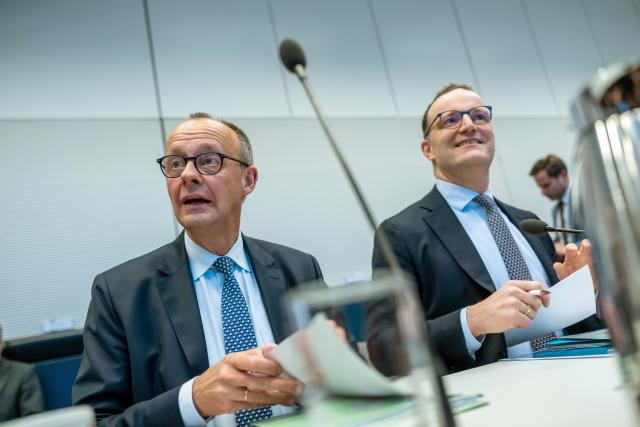 02 December 2025, Berlin: Jens Spahn (R), Parliamentary group leader of the Christian Democratic Union of Germany (CDU) and the Christian Social Union in Bavaria (CSU) in the Bundestag, sits next to German Chancellor Friedrich Merz before the start of the CDU/CSU parliamentary group meeting in the Bundestag. Photo: Michael Kappeler/dpa
