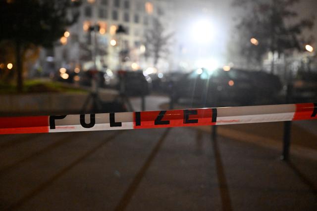 02 December 2025, Munich: A police barricade tape is hung up during a major operation. Photo: Felix Hörhager/dpa