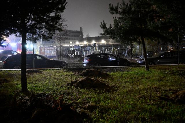 02 December 2025, Munich: A car (C) is parked at the scene during a major operation in the Thalkirchen district. Photo: Felix Hörhager/dpa