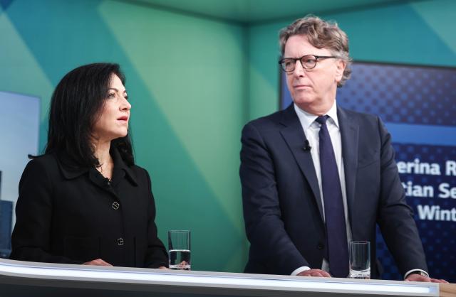 03 December 2025, Hesse, Frankfurt/Main: Katherina Reiche, Germany's Minister for Economic Affairs and Energy, and Stefan Wintels, CEO of KfW, speak at the "Energy and Infrastructure" capital market conference. Photo: Hannes P. Albert/dpa