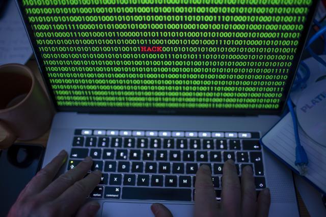 FILED - 04 January 2019, Mecklenburg-Western Pomerania, Schwerin: Between the binary code on a laptop monitor the English word "hack" can be seen. (posed photo) Photo: Jens Büttner/dpa-Zentralbild/ZB
