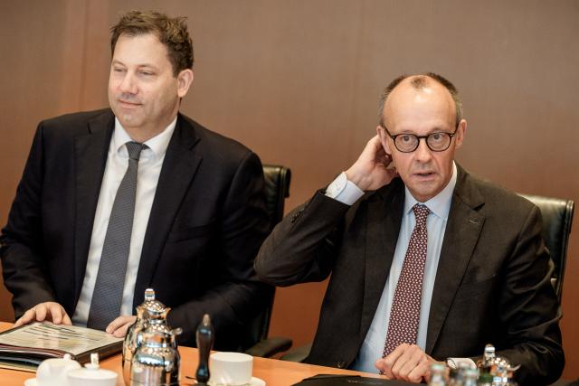 03 December 2025, Berlin: German Chancellor Friedrich Merz (R) waits next to Lars Klingbeil, German Minister of Finance, for the start of the German Cabinet meeting in the Chancellery. Photo: Michael Kappeler/dpa