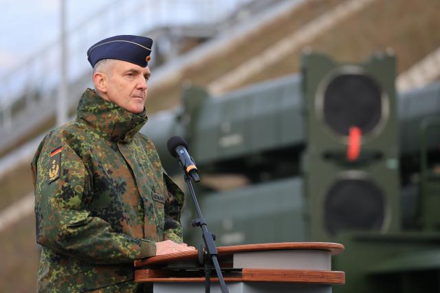 03 December 2025, Saxony-Anhalt, Annaburg: Lieutenant General Holger Neumann, Inspector of the German Air Force, speaks in front of the launch device of the new Arrow 3 missile defense system in front of the radome in Annaburger Heide. The Air Force declares the so-called initial capability of the air defense system and thus completes the first step of commissioning. The air defense system is intended to provide early warning and combat incoming ballistic missiles outside the earth's atmosphere. It is being procured in response to the threat posed by Russia. Photo: Jan Woitas/dpa