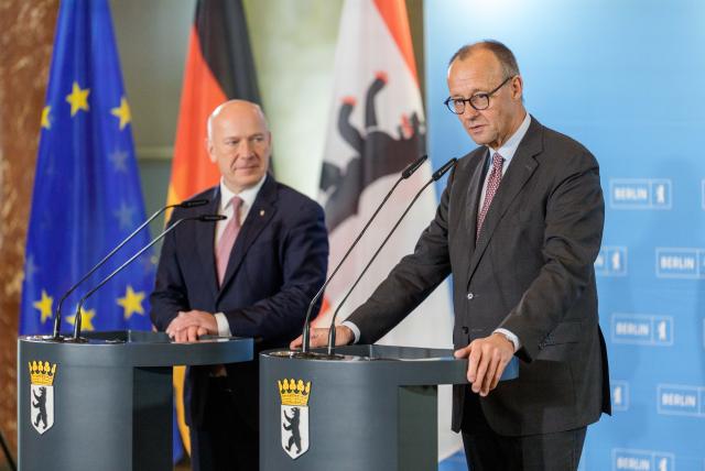 03 December 2025, Berlin: German Chancellor Friedrich Merz (R) takes part in the press conference alongside Kai Wegner, Governing Mayor of Berlin, during his official inaugural visit to Berlin. Photo: Michael Kappeler/dpa