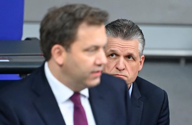 03 December 2025, Berlin: Thorsten Frei (R), Head of the German Chancellery and Federal Minister for Special Tasks, looks at speaker Lars Klingbeil, German Minister of Finance, during the 46th plenary session of the 21st legislative period in the German Bundestag. The main topics of today's session include the government questioning with German Minister of Finance Klingbeil and Head of the Chancellery Frei as well as a current affairs debate on the protests against the founding of an AfD youth organization in Giessen. Photo: Elisa Schu/dpa