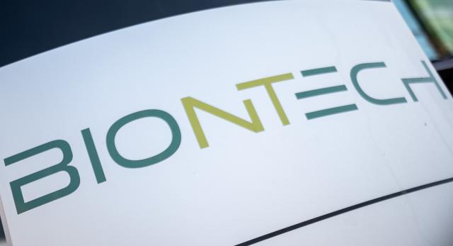 FILED - 09 November 2021, Mainz: Biontech's logo is pictured on a sign at the Corona vaccine manufacturer's headquarters in Mainz. Photo: Sebastian Gollnow/dpa