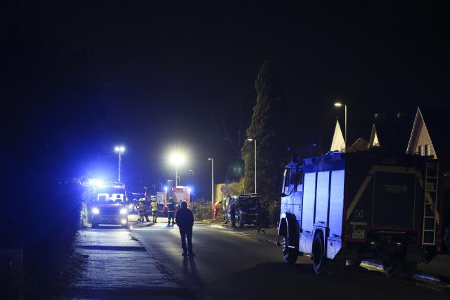 03 December 2025, Schleswig-Holstein, Pinneberg: Emergency services from the fire department and German Federal Agency for Technical Relief (THW) work on a detached house after an explosion. Photo: Christian Charisius/dpa
