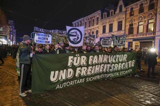 03 December 2025, Bremen: People walk with banners and posters in Bremen's Steintor district during a demonstration by soccer fans under the slogan "For fan culture and freedom rights" against the restriction of fan rights, as the Conference of Interior Ministers (IMK) begins in Bremen. Photo: Focke Strangmann/dpa