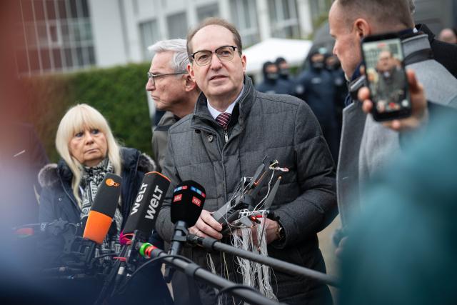 04 December 2025, Bremen: Alexander Dobrindt, Germany's Minister of the Interior, holds an intercepted drone during a Federal Police presentation on drone defense. The Conference of Interior Ministers (IMK) is focusing on drone detection and defense, hybrid threats and the introduction of the new European asylum system (GEAS). Photo: Sina Schuldt/dpa
