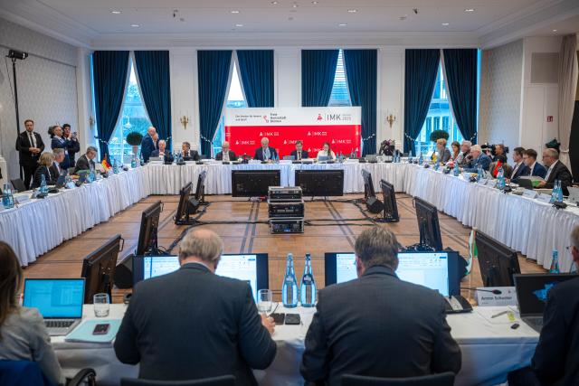 04 December 2025, Bremen: Participants sit in the conference room of the Conference of Interior Ministers (IMK), where discussions focus on drone detection and defence, hybrid threats and the introduction of the new European asylum system (GEAS). Photo: Sina Schuldt/dpa