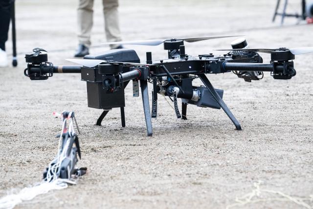 04 December 2025, Bremen: A Federal Police drone flies alongside an intercepted drone during a Federal Police presentation on drone defense. The Conference of Interior Ministers (IMK) focuses on detecting and defending against drones, hybrid threats, and the implementation of the new European asylum system (GEAS). Photo: Sina Schuldt/dpa