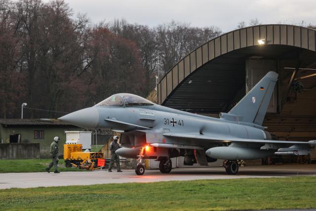 04 December 2025, North Rhine-Westphalia, Noervenich: A German Air Force Eurofighter taxis to the runway at Noervenich airbase. The Luftwaffe has begun transferring Eurofighters from Tactical Air Wing 31 "Boelcke" to the NATO border in Poland. Photo: Oliver Berg/dpa