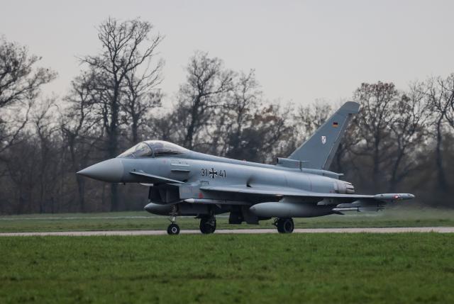 04 December 2025, North Rhine-Westphalia, Noervenich: A German Air Force Eurofighter taxis to the runway at Noervenich airbase. The Luftwaffe has begun transferring Eurofighters from Tactical Air Wing 31 "Boelcke" to the NATO border in Poland. Photo: Oliver Berg/dpa