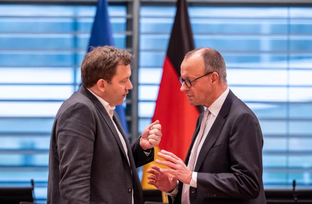 04 December 2025, Berlin: German Chancellor Friedrich Merz talks to Vice Chancellor and Minister of Finance, Lars Klingbeil, ahead of the Minister Presidents' Conference with the heads of the federal states. Photo: Michael Kappeler/dpa