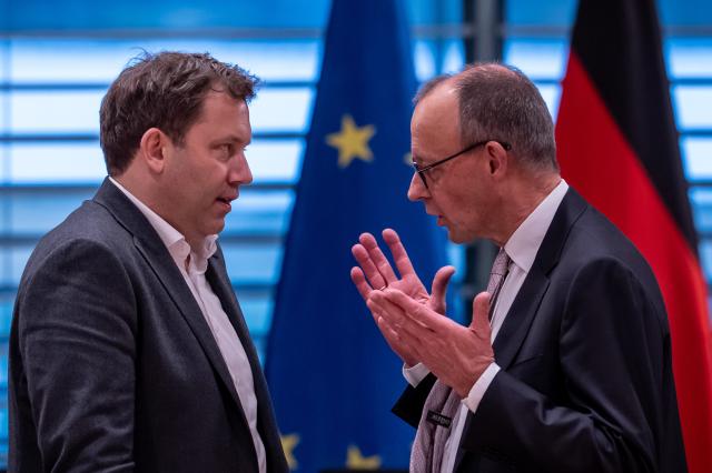 04 December 2025, Berlin: German Chancellor Friedrich Merz talks to Vice Chancellor and Minister of Finance, Lars Klingbeil, ahead of the Minister Presidents' Conference with the heads of the federal states. Photo: Michael Kappeler/dpa