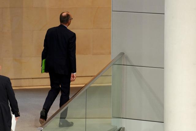 05 December 2025, Berlin: German Chancellor Friedrich Merz leaves the plenary chamber during the German Bundestag session on the modernization of military service. Photo: Kay Nietfeld/dpa