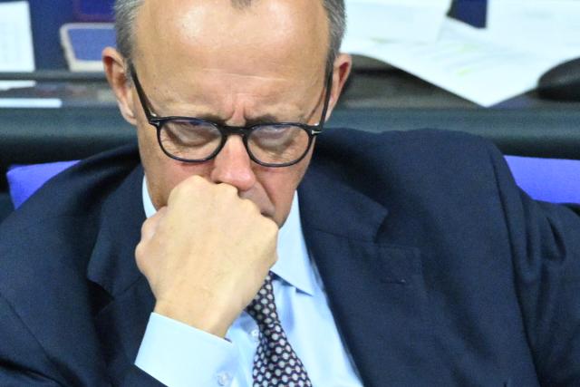 05 December 2025, Berlin: German Chancellor Friedrich Merz follows the German Bundestag session on the modernization of military service. Photo: Christophe Gateau/dpa
