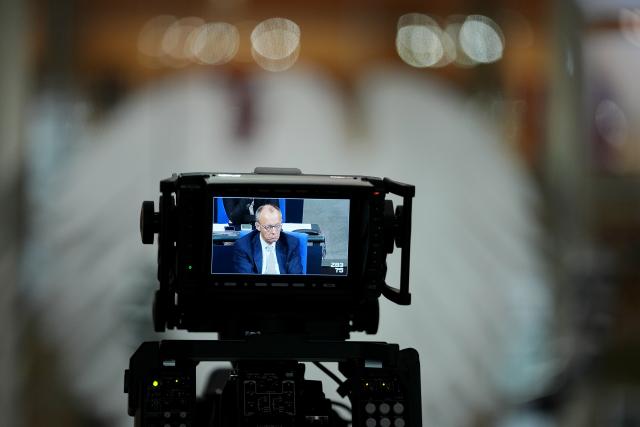 05 December 2025, Berlin: Germany's Chancellor Friedrich Merz can be seen on the display of a camera in the German Bundestag session on the modernization of military service. Photo: Kay Nietfeld/dpa