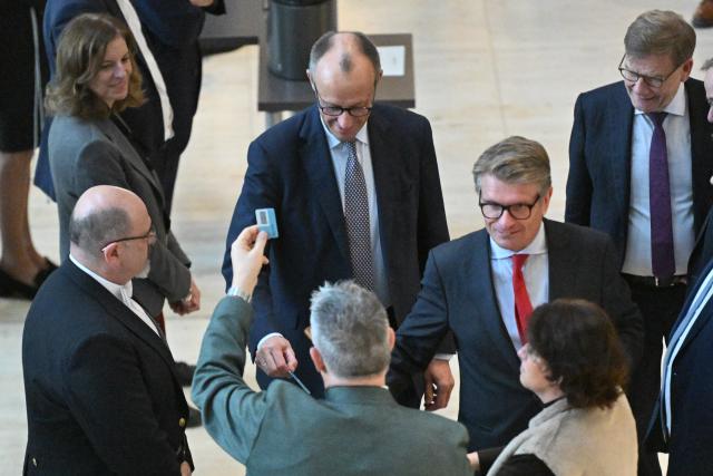 05 December 2025, Berlin: German Chancellor Friedrich Merz casts his vote in a roll-call vote on the pension package in the German Bundestag. Photo: Christophe Gateau/dpa