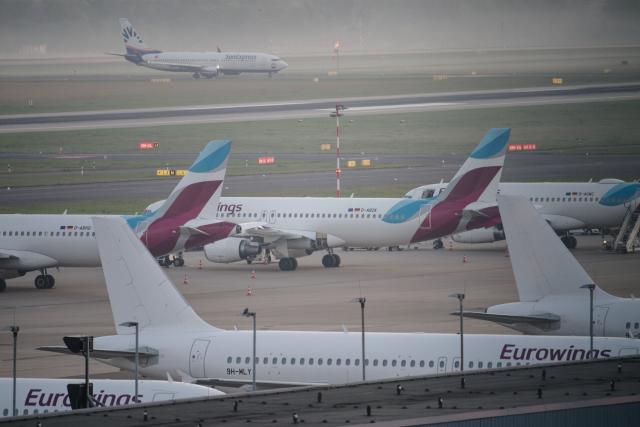 FILED - 12 April 2025, North Rhine-Westphalia, Landesweit: Eurowings airline planes are parked at Duesseldorf Airport. Photo: Henning Kaiser/dpa