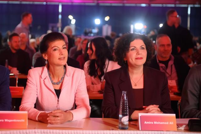 06 December 2025, Saxony-Anhalt, Magdeburg: Sahra Wagenknecht Alliance (BSW) chairpersons Sahra Wagenknecht (L) and Amira Mohamed Ali (R) sit next to each other at the 3rd national party conference of the "Sahra Wagenknecht Alliance" party. Photo: Klaus-Dietmar Gabbert/dpa