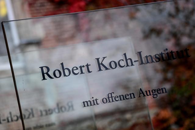 FILED - 12 November 2020, Berlin: The sign of the Robert Koch Institute is seen in front of the headquarters of the Federal Institute for Infectious Diseases and Noncommunicable Diseases. Photo: Britta Pedersen/dpa