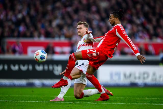 06 December 2025, Baden-Württemberg, Stuttgart: Stuttgart's Maximilian Mittelstaedt (L) in action against Bayern Munich's Michael Olise during the German Bundesliga socce rmatch between VfB Stuttgart and FC Bayern Munich at the MHPArena. Photo: Tom Weller/dpa - IMPORTANT NOTICE: DFL and DFB regulations prohibit any use of photographs as image sequences and/or quasi-video.