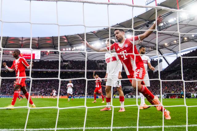 06 December 2025, Baden-Württemberg, Stuttgart: Bayern Munich's Raphael Guerreiro celebrates his side's first goal by Konrad Laimer during the German Bundesliga socce rmatch between VfB Stuttgart and FC Bayern Munich at the MHPArena. Photo: Tom Weller/dpa - IMPORTANT NOTICE: DFL and DFB regulations prohibit any use of photographs as image sequences and/or quasi-video.