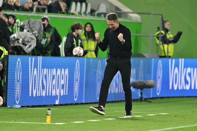 06 December 2025, Lower Saxony, Wolfsburg: Wolfsburg coach Daniel Bauer celebrates after the German Bundesliga soccer match between VfL Wolfsburg and 1. FC Union Berlin at the Volkswagen Arena. Photo: Swen Pförtner/dpa - IMPORTANT NOTICE: DFL and DFB regulations prohibit any use of photographs as image sequences and/or quasi-video.