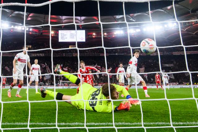06 December 2025, Baden-Württemberg, Stuttgart: Stuttgart goalkeeper Alexander Nuebel fails to save Bayern's Stanisic third goal during the German Bundesliga socce rmatch between VfB Stuttgart and FC Bayern Munich at the MHPArena. Photo: Tom Weller/dpa - IMPORTANT NOTICE: DFL and DFB regulations prohibit any use of photographs as image sequences and/or quasi-video.