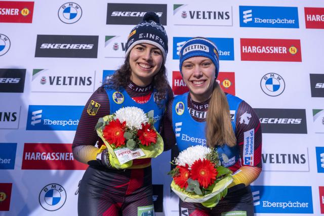 06 December 2025, North Rhine-Westphalia, Winterberg: Germany's winning team of Jessica Degenhardt (L) and Cheyenne Rosenthal celebrates after their victory in the Women's doubles competition of the Luge World Cup in Winterberg. Photo: David Inderlied/dpa