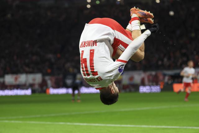 06 December 2025, Saxony, Leipzig: Leipzig's Christoph Baumgartner celebrates scoring his side's second goal during the German Bundesliga soccer match between RB Leipzig and Eintracht Frankfurt at the Red Bull Arena. Photo: Jan Woitas/dpa - IMPORTANT NOTICE: DFL and DFB regulations prohibit any use of photographs as image sequences and/or quasi-video.