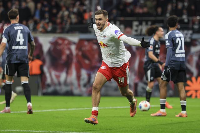 06 December 2025, Saxony, Leipzig: Leipzig's Christoph Baumgartner celebrates scoring his side's second goal during the German Bundesliga soccer match between RB Leipzig and Eintracht Frankfurt at the Red Bull Arena. Photo: Jan Woitas/dpa - IMPORTANT NOTICE: DFL and DFB regulations prohibit any use of photographs as image sequences and/or quasi-video.