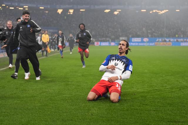 07 December 2025, Hamburg: Hamburger's Yussuf Poulsen celebrates scoring his side's third goal during the German Bundesliga soccer match between Hamburger SV and SV Werder Bremen at the Volksparkstadion. Photo: Marcus Brandt/dpa - IMPORTANT NOTICE: DFL and DFB regulations prohibit any use of photographs as image sequences and/or quasi-video.