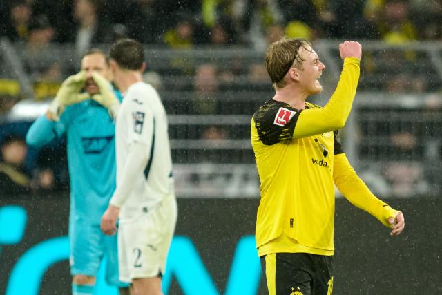 07 December 2025, North Rhine-Westphalia, Dortmund: Borussia Dortmund's Julian Brandt (R) celebrates scoring his side's first goal during the German Bundesliga soccer match between Borussia Dortmund and TSG 1899 Hoffenheim at Signal Iduna Park. Photo: Bernd Thissen/dpa - IMPORTANT NOTE: In accordance with the regulations of the DFL German Football League and the DFB German Football Association, it is prohibited to utilize or have utilized photographs taken in the stadium and/or of the match in the form of sequential images and/or video-like photo series.